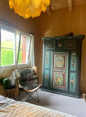 a wooden table with plates of food on it at Doppelzimmer in charmantem B&B in Hemberg
