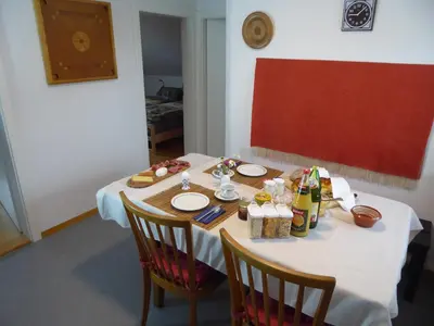 a table with plates of food and drinks on it at 22 – Zimmer & Zmorge in Kreuzlingen