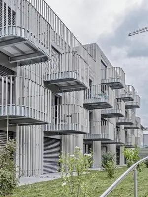 a building with balconies on the side of it at MOOI Apartments St.Gallen in St. Gallen