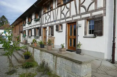 an old house with stairs in front of it at Family Landhaus Birwinken in Berg