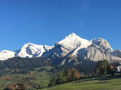 a mountain range with snow capped mountains in the background at Dachwohnung Zentrum Unterwasser in Unterwasser
