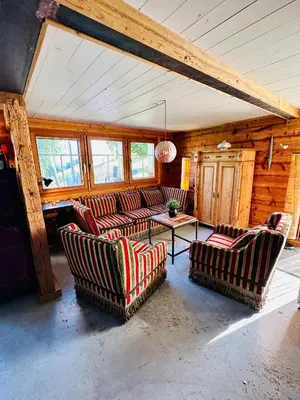 a living room with couches and a table at Birkenhof, Haus Märli in Herisau