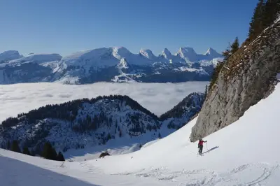 a person is skiing down a snow covered mountain at Studio Bijou in Unterwasser