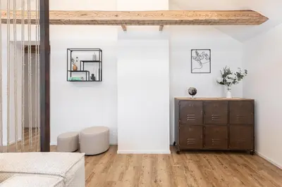 a living room with a dresser and a mirror at Dein Zuhause in Herisau in Herisau