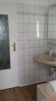 a bathroom with a sink and a mirror at Konstanz nähe, ruhiges 4-Zim-Wohnung bis 8 Personen in Kreuzlingen