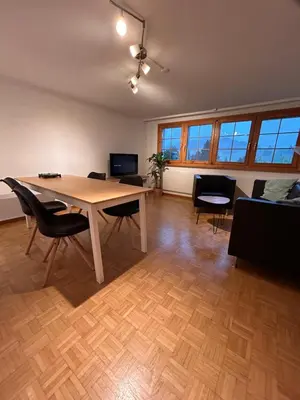 an office with a table and chairs in a room at Ferienwohnung mit Aussicht in Gais