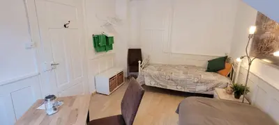 a staircase with a mirror in a room at 2 Zimmer Zentral-ruhig mit Flair Gertrud Schlössli 3Z2 in St. Gallen