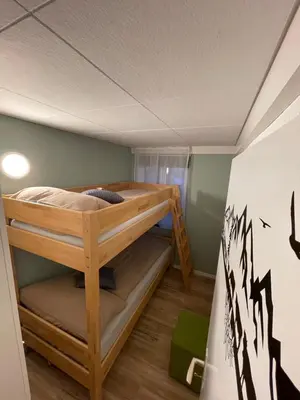 a room with two bunk beds in it at Ferienwohnung Edelweiss in Wolfhalden