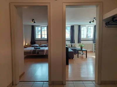 a room with a bedroom and a bed and a living room at Global Citizen 5 in St. Gallen