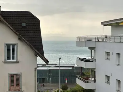 a microwave with a coffee maker on top of it at Ferienwohnung am Bodensee in Rorschach