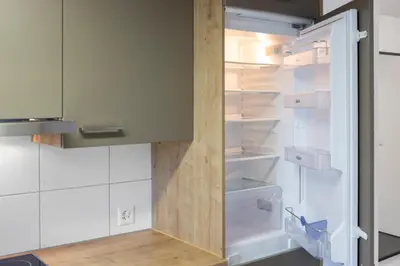 a refrigerator with its door open in a kitchen at Klara 1022 - Olma, Spital, Uni St- Gallen in St. Gallen