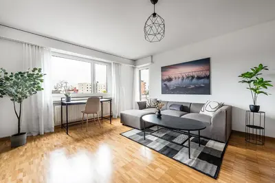 a living room with a couch and a table at SOHO 4A !Gratis Parken, Free Parking! in Kreuzlingen
