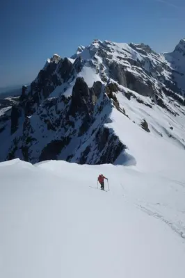 a person is skiing down a snow covered mountain at Ferienwohnung Halden in Unterwasser