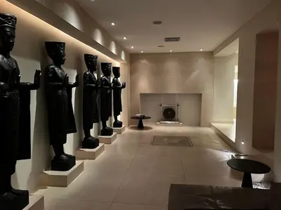 a room with statues of people on the wall at VILLA Philipp Plein - Designervilla mit Pool & SPA in Amriswil