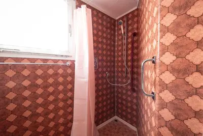 a bathroom with a shower with a shower curtain at 11 - Gästehaus Erika - Hundwil - Appenzellerland in Hundwil