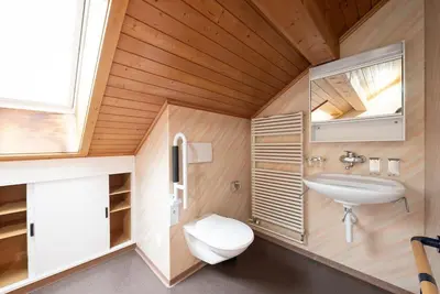a small bathroom with a sink and a toilet at 25 - Gästehaus Erika - Hundwil - Appenzellerland in Hundwil