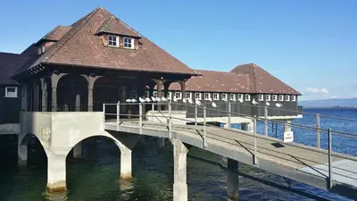 a building on a pier in the water at Bauernhaus Hinterbühle in Wolfhalden
