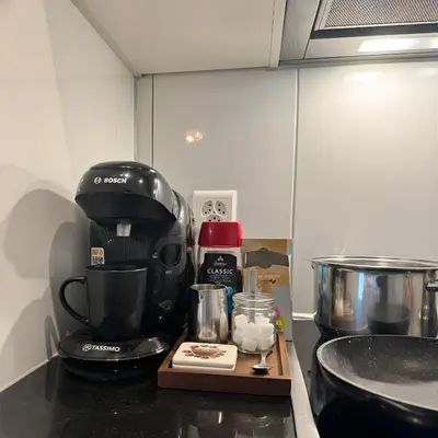 a coffee maker on a counter in a kitchen at Zentrales Apartment St Gallen an der Olma in St. Gallen