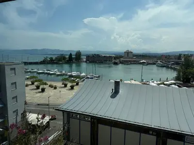a view of a harbor with boats in the water at book2stay - Lakeview Apartment in Romanshorn