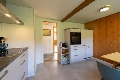 a bathroom with a white sink and a mirror at Fuechsle in Wildhaus