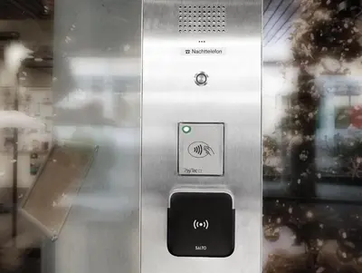 a close up of a metal door with a button at Hotel Thurgauerhof Self-Check-in in Weinfelden