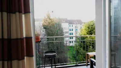 a balcony with a view of a building at Ninety Apartments in St. Gallen