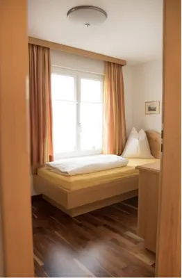 a bedroom with a bed and a window at Haus Engel Gams in Gams