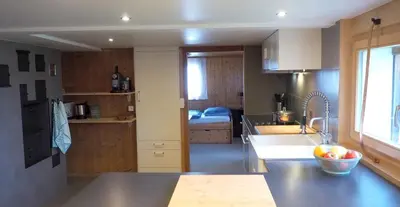 a kitchen with a sink and a counter top at Mällis Heimetli in Urnäsch