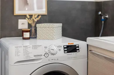 a white washer and dryer in a bathroom at Klara 1034 - Olma, Spital, Uni St- Gallen in St. Gallen