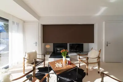 a living room with a large flat screen tv at Alpstein in Wildhaus