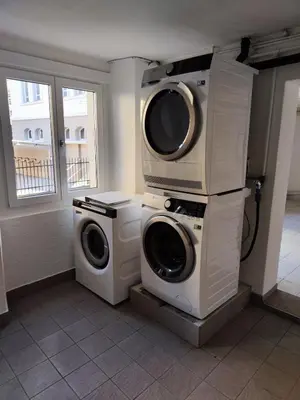 a laundry room with a washer and dryer at Schöne Wohnung im Herzen von Herisau bis 6 Gäste in Herisau
