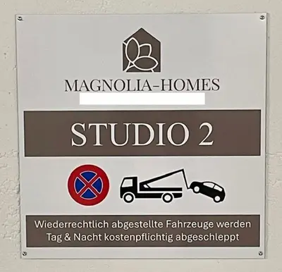 a sign for ahibula homes studio with cars at DESIGN-STUDIO 2 !Gratis Parken, Free Parking! in Kreuzlingen