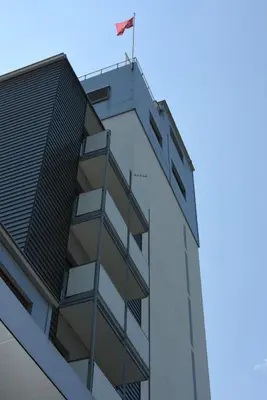 a building with a flag on top of it at Towerhotel in Waldkirch