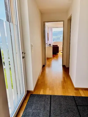an empty hallway with an open door to a room at Appenzellerland, 2 Zimmer Ferienwohnung mit Aussicht in Haslen