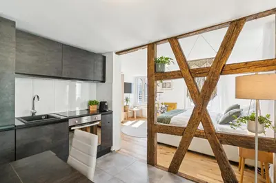 a kitchen and living room with a loft bed at Klara 1014 - Olma, Spital, Uni St- Gallen in St. Gallen