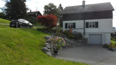 a car parked in front of a house at Wenk Elisabeth in Wildhaus