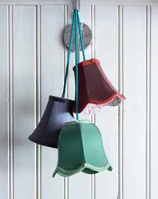 three bells hanging on a wall at Ferienhaus Lindeli, Luxeriös eifach in Sankt Peterzell