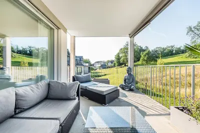a living room with a couch and a table at DESIGN-APARTMENT 2 !Gratis parken, Free Parking! in Kreuzlingen