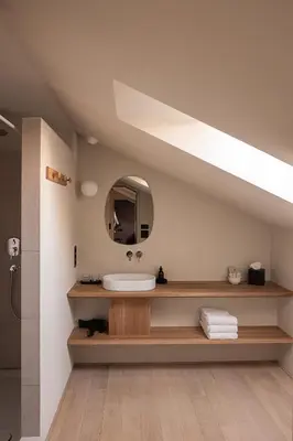 a bathroom with a sink and a mirror at normalkonsum - premium apartments in St. Gallen