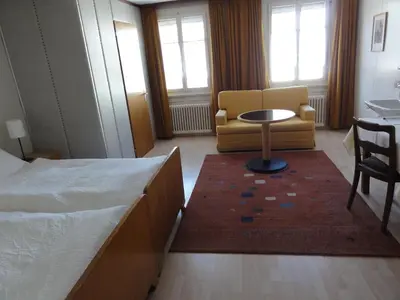 a bedroom with a bed and a table and a chair at Park in Heiden