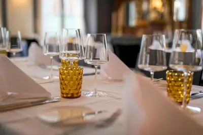 a table with wine glasses on top of it at Gasthaus zur Sonne - Hotel - Restaurant - Boutique in Gossau