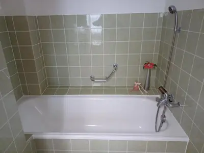 a bath tub in a bathroom with a shower at Studio Marylin in Rorschach