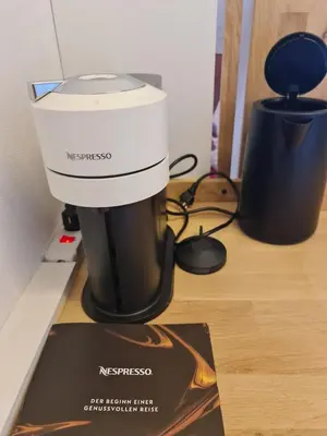 a mixer sitting on a counter next to a magazine at Maisonette-Wohnung inmitten der Natur in Wald