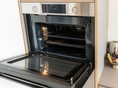 an oven with its door open in a kitchen at Stilvoll&zentral in St Gallen -WYBA Living P in St. Gallen