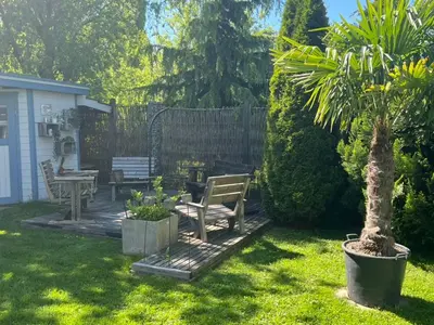 a deck with two couches and a bench on it at Apartment with charm and dream view in Hosenruck