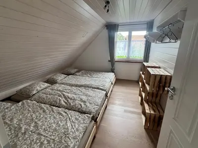 a bathroom with a glass shower and a sink at Apartment with charm and dream view in Hosenruck