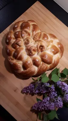 a pastry in the shape of a heart on a cutting board at B&B Hofgenuss in Ganterschwil
