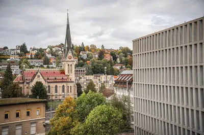 a view of a city with a building and a church at Stilvoll & zentral in St Gallen -WYBA Living Rio in St. Gallen