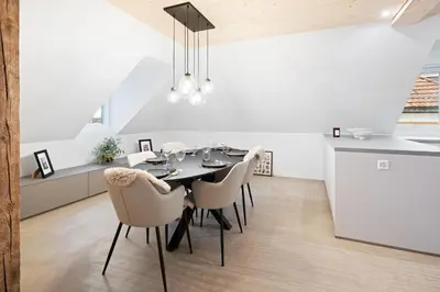a dining room with a table and chairs at BLIV Grosszügiges Altbaujuwel im Zentrum in St. Gallen