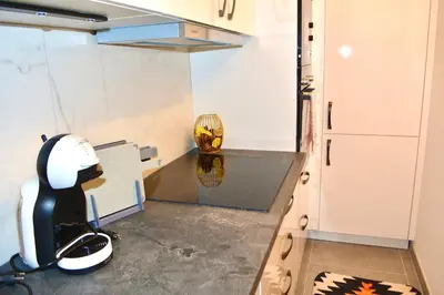 a office with a desk and a chair in a room at Luxuswohnung in Bodensee, im Radweg mit Parkplatz in Romanshorn